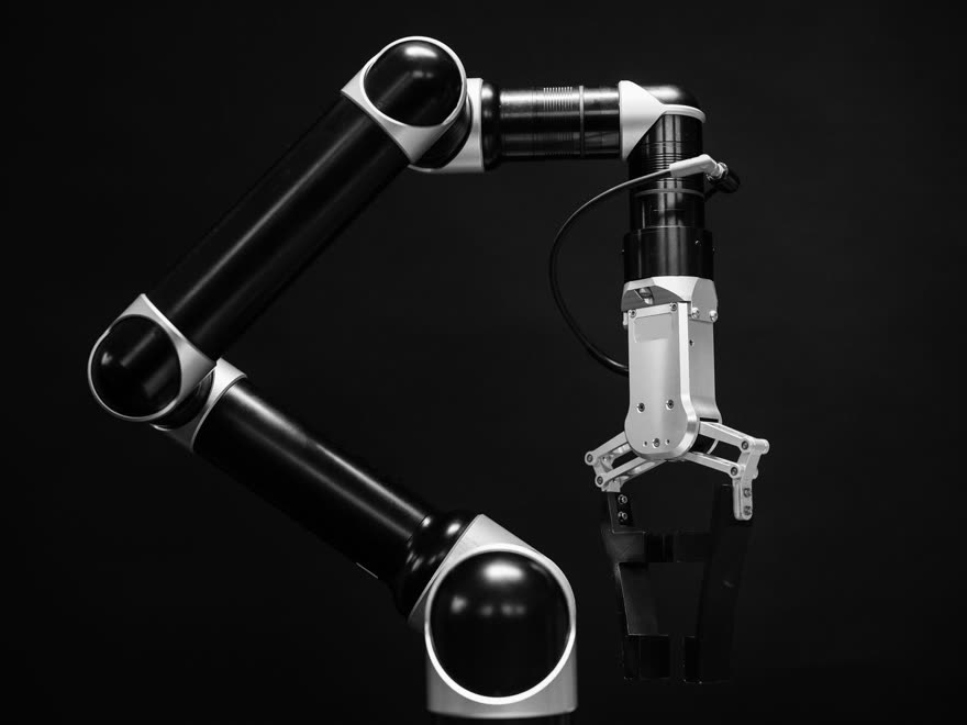 A robot arm against a black background